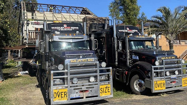 Hamish Webster's house pictured being loaded onto two trucks.