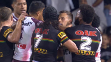 Luke Brooks and Jarome Luai separated by teams after a heated exchange.