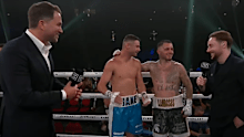 George Kambosos Jnr. embraces Jake Wyllie after Eddie Hearn's promise. 