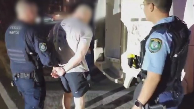 Tarek Zahed being arrested by NSW Police officers. 