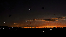 This photo provided by Trisha Bushey shows the evening sky and points of light near in Lebanon Township, N.J., on Thursday, Dec. 5, 2024. (Trisha Bushey via AP)