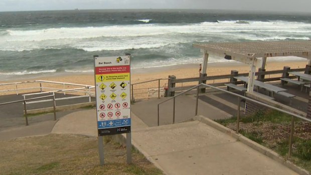 A 36-year-old man will front court next month after allegedly displaying Nazi tattoos on a beach in Newcastle.