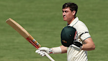 Matt Renshaw celebrates his century for the Prime Minister's XI in Canberra.