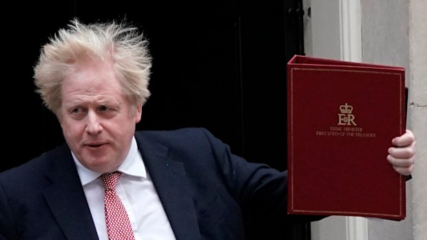 Britain's Prime Minister Boris Johnson leaves 10 Downing Street, to head to the House of Commons. 