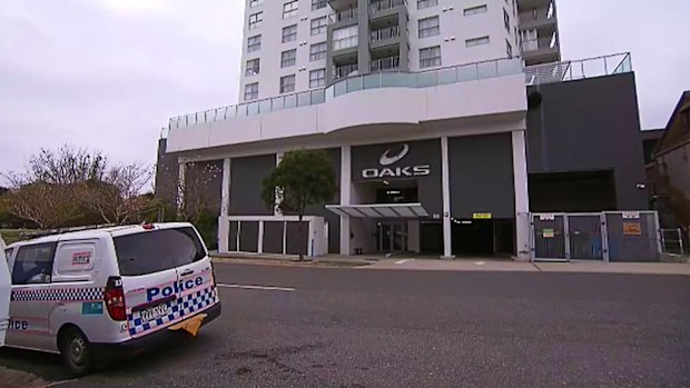 Queensland Police have claimed a man was attempting to run from officers before falling to his death from the 13th floor balcony of an Ipswich unit building yesterday. 