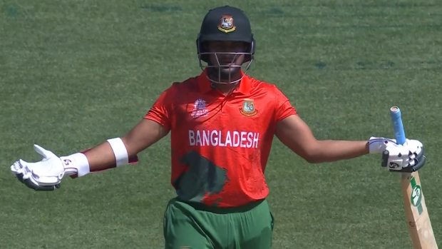 Shakib Al Hasan raises his hands in disgust after being given out.