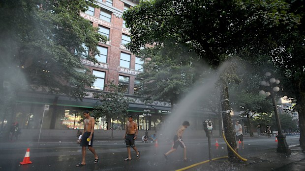 A temporary misting station on Abbott Street during a heatwave in Vancouver, British Columbia.
