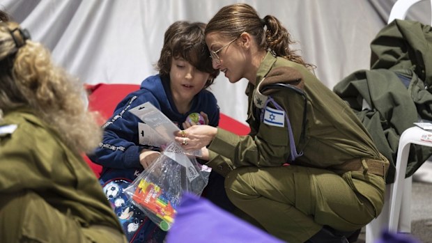 This handout photo provided by the Israel Prime Minister Office shows Naveh Shoham, 8 years old, upon his arrival in Israel after being freed. Naveh was one of the 13 Israeli hostages that Hamas released late Saturday, Nov. 25, 2023, in the second round of swaps under a cease-fire deal.