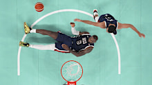 United States' LeBron James (6) falls to the ground during a men's gold medal basketball game at Bercy Arena at the 2024 Summer Olympics, Saturday, Aug. 10, 2024, in Paris, France. (Evelyn Hockstein/Pool Photo via AP)