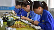 Workers on a production line in Fuyang city, Anhui province, China on April 15, 2025.