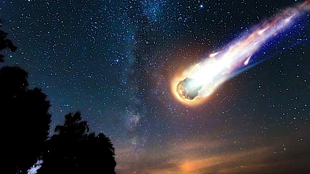 A comet, an asteroid, a meteorite falls to the ground against a starry sky, as researchers discovered the first known interstellar meteor to ever hit Earth. 