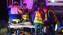 A hero truck driver has told of the moment he and a workmate waded into Adelaide's Dry Creek Wetlands to save a crash victim from his burning car.