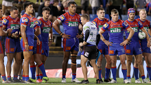 Dejected Knights players during their loss to the Roosters.