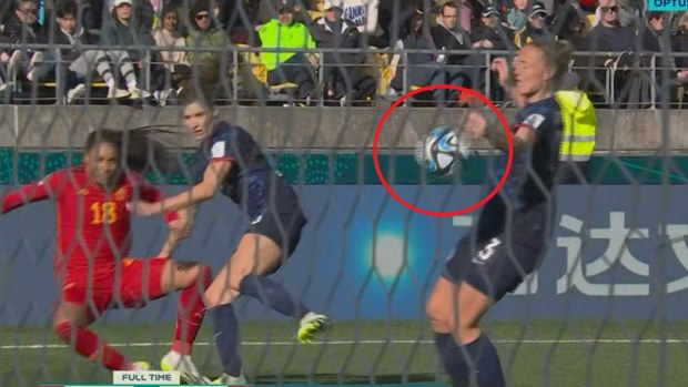 Netherlands player Stefanie van der Gragt handballs inside the penalty area.