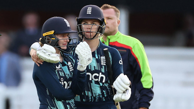 Charlie Dean of England is consoled by Freya Davies after Dean was run out by India's Deepti Sharma via a Mankad.