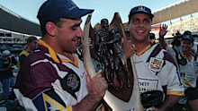 Tony Carroll (left) and Steve Renouf with the premiership trophy after winning the 1998 NRL grand final.