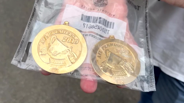 Police have uncovered two AFL Premiership medals during a raid in Melbourne's south-east