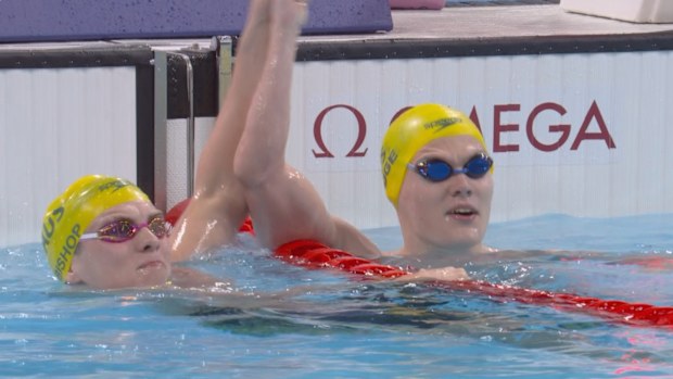 Timothy Hodge (R) lifts arm of Lewis Bishop (L) to celebrate podium finish.