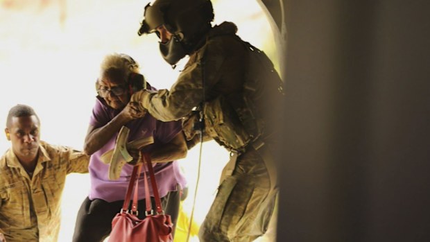 Hundreds of residents were flown from the remote far north community of Wujal Wujal to Cooktown after being stranded for days. Some residents were rescued from rooves and flood-ravaged properties in a major military operation.