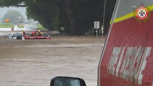 Heavy rainfall in Far North Queensland has sparked rescues for motorists stranded in floodwaters.Rescuers become life savers for the 65-year-old woman stuck on top of her car at Mossman, north-west of Cairns, about 6am today.