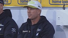David Warner watches on from the sidelines.