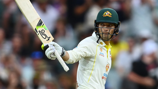 Alex Carey celebrates scoring a half century during day two of the Second Test.