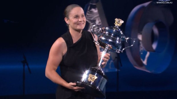 Ash Barty returning the Daphne Akhurst Memorial Trophy to Rod Laver Arena ahead of the women's singles final.