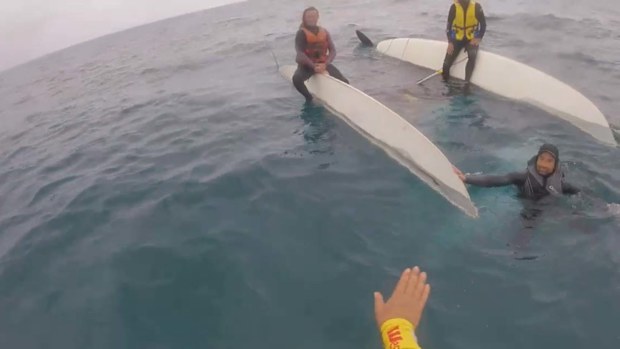 Three people have been rescued after their boat overturned on the NSW South Coast.