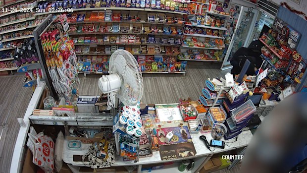 Hurstbridge: A milkbar worker has described the moment she jumped onto the back of an unknown man who shot paint at her in an attempted robbery in Melbourne's north-east. 