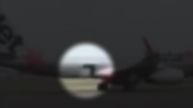 Footage shows the moment a Jetstar flight began taxiing with a cargo door wide open.