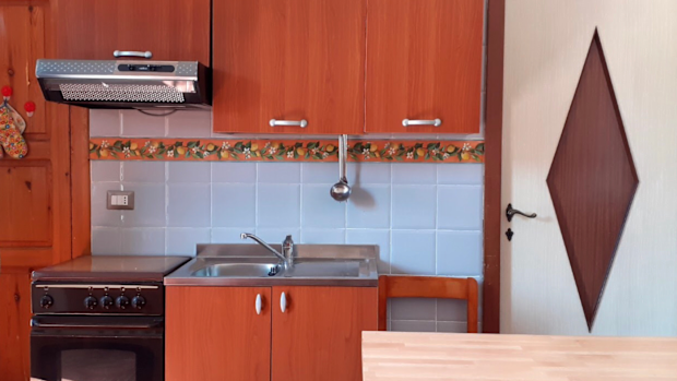 Mauro Morandi's new home comes with a fitted ktichen, a luxury compared to his old hut.