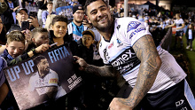 Andrew Fifita poses with fans at full time. 