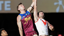 Harris Andrews of the Lions and Logan McDonald of the Swans compete for the ball during round 19.