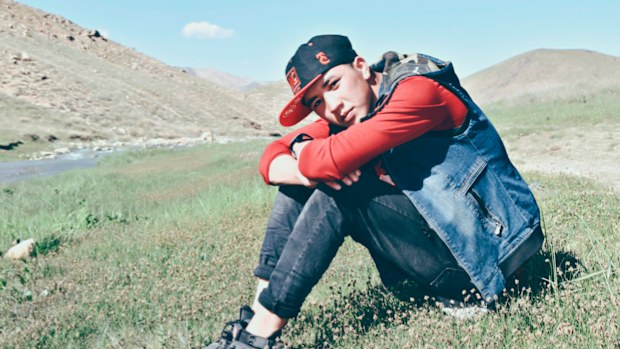 Hussaini, pictured in Afghanistan, and his family rushed to Kabul Airport after being warned the nation was about to fall.