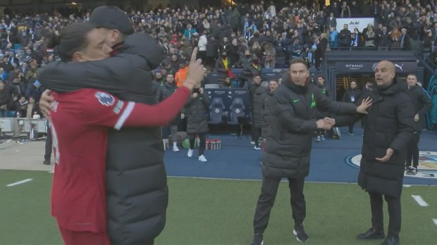 Liverpool manager Jurgen Klopp separates Darwin Nunez from Manchester City manager Pep Guardiola.