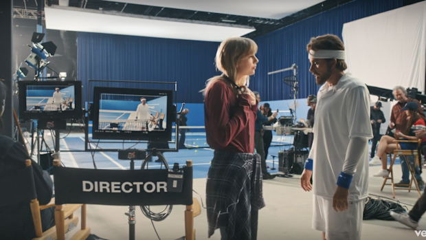 The Man wears merch in Taylor Swift's music video.
