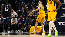 Joe ingles lies on the ground in pain after suffering a knee injury. 