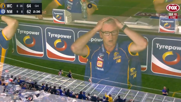Adam Simpson looks on after umpire's call.