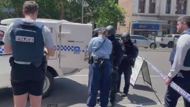 A man has been arrested after refusing to leave his hotel room while allegedly armed in Sydney's CBD this afternoon. 
