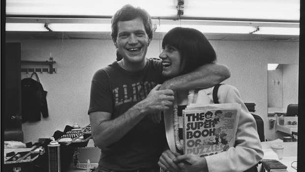 David Letterman poses in his dressing room with girlfriend Merrill Markoe during a 1982 photo portrait session in New York City, New York. 