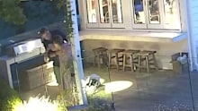 The mother of four's traumatic brush with death was captured on home security cameras, showing her getting up from the table of six and coughing on the patio before splitting her head open as she collapsed on the ground.