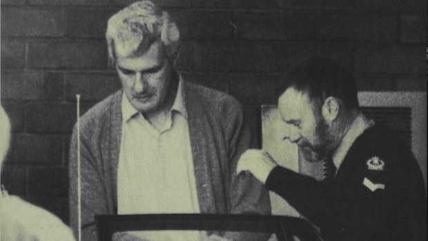 Bevan Spencer Von Einem being escorted from Adelaide Magistrates Court.