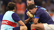 Antoine Dupont, the France captain, receives treatment following head contact with Johan Deysel.