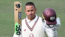 HOBART, AUSTRALIA - MARCH 06: Usman Khawaja of Queensland celebrates scoring a century during the Sheffield Shield match between Tasmania Tigers and Queensland Bulls at Blundstone Arena, on March 06, 2025, in Hobart, Australia. (Photo by Steve Bell/Getty Images)