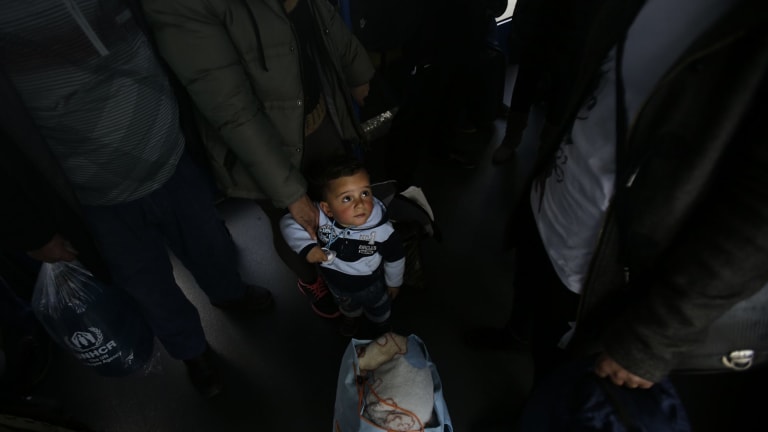 Argesh, 2, in Athens last week after his Yazidi family fled the IS-held city of Mosul, hoping to reach Germany. IS is one of the forces pushing Iraqis and Syrians to seek refugee in Europe.