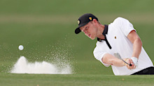 Cropped: Cam Davis of Australia and the International Team plays a shot from a bunker on the 16th hole during the Thursday foursome matches on day one of the 2022 Presidents Cup at Quail Hollow Country Club on September 22, 2022 in Charlotte, North Carolina. (Photo by Rob Carr/Getty Images)