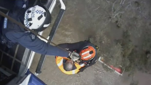 Two people have been rescued after their truck became submerged in floodwater near Geelong.
