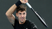 ADELAIDE, AUSTRALIA - JANUARY 04:  Thanasi Kokkinakis of Australia in action against John Millman of Australia during day three of the 2022 Adelaide International at Memorial Drive on January 04, 2022 in Adelaide, Australia. (Photo by Sarah Reed/Getty Images)