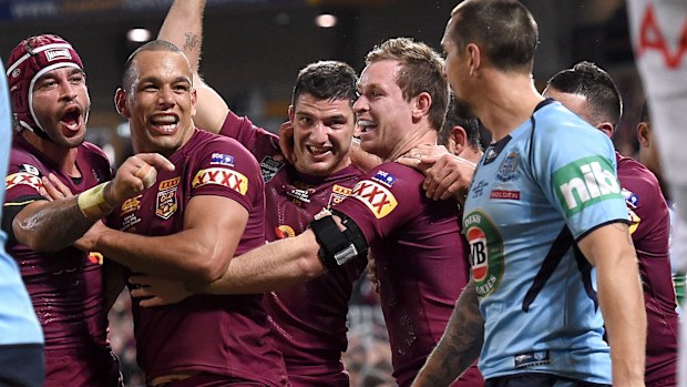 Mitchell Pearce (right) was tormented by a great Queensland side.