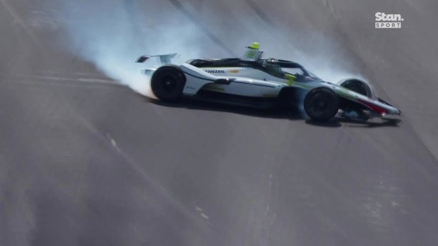 Nolan Siegel spins after hitting the outside wall at turn one in qualifying for the Indianapolis 500.